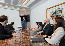 Team meeting in a Servcorp meeting room at 10 Avenue Kléber, equipped for high-level presentations and professional events.